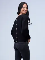 Buzo marca Cupio de tejido acanalado color azul. Tiene mangas largas estilo dolman y aplique de botones en la espalda.