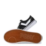 Championes urbanos Pony de corte bajo, confeccionados en una combinación de lona y gamuza en color negro. Presentan el diseño característico de la marca en los laterales en color blanco, cordones blancos y suela de goma vulcanizada blanca con una línea negra decorativa.