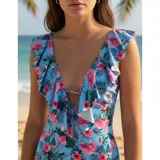Malla enteriza color celeste con estampado de flamencos y flores tropicales. Presenta escote en V profundo con volados decorativos en los hombros y el frente, y diseño de espalda abierta.