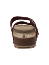 Sandalias de cuero color bordó, con diseño de tiras cruzadas en el empeine y una tira ajustable con hebilla metálica. Cuenta con plantilla acolchada y suela de corcho con base de goma antideslizante.
