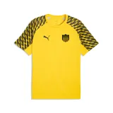 Camiseta de entrenamiento Puma del Club Atlético Peñarol, color amarillo con mangas estampadas en degradado negro y amarillo. Presenta el logo de la marca y el escudo del club en el frente.