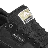 Championes Emerica Gamma G6 negros con logo dorado en el talón y en la lengüeta.