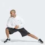 Short Adidas de corte holgado, confeccionado en tejido liso de poliamida. Presenta cintura con cordón de ajuste, bolsillos laterales con cierre y logo reflectante en la pierna.