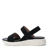 Sandalias de plataforma con tiras elásticas texturizadas en color beige. Presentan una base ergonómica de goma blanca con diseño estriado y plantilla acolchada al tono.
