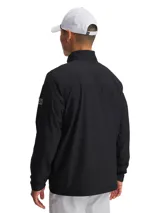 Campera deportiva Under Armour modelo UA Drive Pro FZ, color negro, con cuello alto, cierre frontal completo y bolsillos laterales con cremallera. Presenta diseño acolchado en el pecho y parte superior de la espalda, con mangas lisas y el logo de la marca en la manga izquierda.