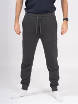 Pantalón babucha deportivo unisex de felpa, color gris oscuro, con tiro alto, puños y cordones ajustables.