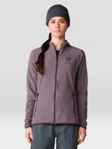 Campera polar de Mountain Hardwear, modelo Microchill Full Zip, de color bordó melange. Cuenta con cuello alto, cierre frontal completo, bolsillos laterales con cierre y mangas raglán. Presenta un pequeño parche con el logo de la marca en el pecho.