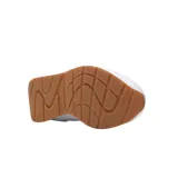 Championes Reebok Royal Glide de cuero blanco con detalles en gris y suela de goma color caramelo.