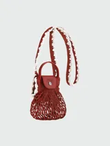 Bolso crossbody Longchamp modelo Le Pliage Xtra Filet Craft XS, de diseño tipo red en color terracota con detalles en cuero al tono, manijas cortas y correa larga ajustable.