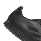 Championes de fútbol Adidas Goletto IX para pasto sintético, color negro con las tres tiras características de la marca en el lateral. Exterior de cuero sintético suave con acolchado y perforaciones. Suela de caucho con taches.