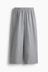 Pantalón de corte holgado en algodón con motivo de rayas verticales en azul marino y blanco, piernas amplias y tiro alto con cintura elástica.
