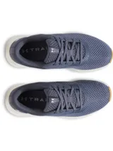 Championes de entrenamiento Under Armour Charged Aurora 2, diseñados específicamente para el pie femenino. Presentan una parte superior de malla transpirable en color azul, refuerzos de TPU para mayor estabilidad, entresuela Charged Cushioning para amortiguación y suela de goma con tracción multidireccional.