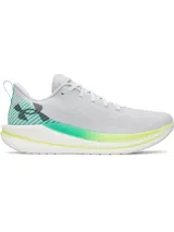 Championes de running Under Armour Velociti Spd, color gris claro con detalles en verde y amarillo en la suela y logo de la marca en el talón.