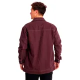 Chaqueta unisex de color bordó con cuello camisero y cierre frontal de botones metálicos. Presenta bolsillos con solapa en el pecho, bolsillos inferiores de entrada lateral y etiqueta con el logo de la marca CAT en el pecho izquierdo.