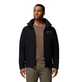 Chaqueta softshell negra con capucha desmontable, cierre frontal completo y bolsillos con cremallera. Presenta logo de la marca bordado en el pecho y puños ajustables.