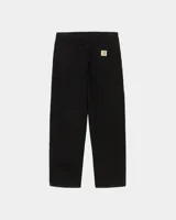Pantalón de trabajo estilo carpenter, color negro, con refuerzos en las rodillas y remaches metálicos. Presenta un corte recto y holgado.