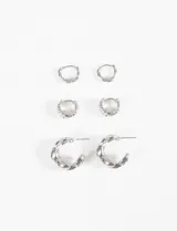 Set de tres pares de aros plateados con diferentes diseños de textura.