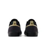 Championes de skate New Balance Numeric 306, modelo profesional de Jamie Foy, en color negro con detalles en tostado y el logo "N" en gris en los laterales.