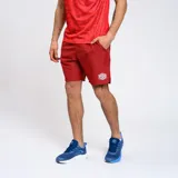 Bermuda deportiva azul marino con escudo del Club Nacional de Football y logo de Umbro.