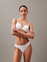 Colaless blanca de algodón elástico extra suave, con cintura fina y flexible con logo de Calvin Klein en el lateral.