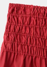 Falda midi evasé color bordó con cintura fruncida elástica.
