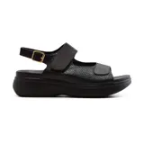 Sandalias negras con plataforma, tiras anchas con ajuste de velcro y hebilla.