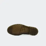 Botas Chelsea Dr. Martens modelo 2976, confeccionadas en cuero liso negro con acabado brillante. Presentan paneles elásticos laterales, tirador en el talón y la característica suela con amortiguación de aire y costuras amarillas visibles.