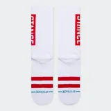 Medias Stance OG negras con rayas blancas horizontales en el tobillo y logo de la marca en la caña.