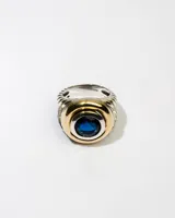 Anillo de plata 925 con dublé de oro y zirconia azul redonda.