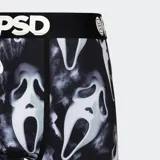 Calzoncillos tipo bóxer de la marca PSD, con estampado de caras de fantasmas sobre fondo negro. Cuenta con pretina elástica negra con el logo de la marca en blanco.