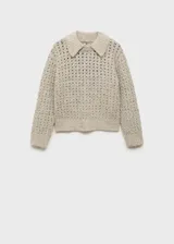 Jersey de punto calado con textura gruesa, cuello polo y terminaciones de canalé en puños y ruedo.