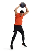 Remera deportiva Under Armour Vanish Elite Seamless de manga corta, color naranja con logo iridiscente en el pecho. Presenta un diseño sin costuras con zonas de ventilación estratégicas para mayor transpirabilidad y tecnología UA RUSH para reflejar la energía corporal.