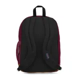 Mochila Jansport color borgoña con base de cuero sintético marrón. Tiene dos compartimentos principales, funda interna para laptop, bolsillo lateral para botellas, bolsillo frontal con panel de organización y clip para llaves, panel trasero acolchado, dos bolsillos exteriores con cremallera y tirantes ergonómicos curvados en S.