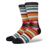 Medias Stance Baron de caña alta con diseño geométrico multicolor.