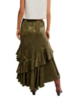 Falda maxi color verde oliva con diseño floral jacquard, corte asimétrico y múltiples volantes en el ruedo. Presenta un detalle de lazo lateral y cintura elástica.