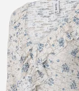 Blusa Blue Steel de encaje con estampado floral, escote en V y volados frontales, de manga larga.