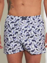 Bóxer de algodón blanco con estampado de flores pequeñas color celeste, con cintura elástica y logo de la marca en el centro.