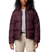 Campera tipo puffer Columbia, color bordó, con cierre frontal completo, cuello alto con protector de mentón, bolsillos laterales con cremallera y puños elásticos. Cuenta con aislamiento térmico sintético y tejido impermeable.