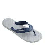 Sandalias tipo ojota Havaianas modelo Track, con base blanca texturizada y tiras anchas de goma en color azul marino con logo de la marca.