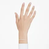 Pulsera dorada con cristales blancos redondos engarzados en bisel.