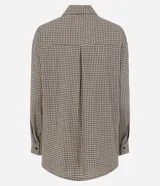 Camisa oversized de algodón con estampado de cuadros, cuello camisero clásico, mangas largas y corbata confeccionada en el mismo tejido.