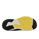 Championes de running New Balance Fresh Foam X Evoz V4 para mujer, color lila con detalles en amarillo y negro.