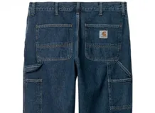 Pantalón de trabajo de corte relajado y recto, confeccionado en denim de algodón negro. Presenta bolsillos utilitarios, presilla para martillo y costuras reforzadas para mayor durabilidad.