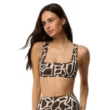 Corpiño de bikini Rip Curl modelo Sseries Crop, de corte deportivo con escote cuadrado y tirantes anchos, con diseño estampado geométrico en color marrón y beige.
