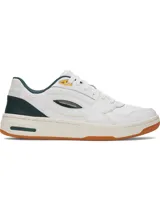 Championes Under Armour modelo Flex, de diseño urbano en color blanco con detalles en verde oscuro y suela de goma color caramelo. Presentan empeine de cuero premium, entresuela de EVA para mayor amortiguación y panel acanalado en el talón.