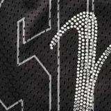 Short de malla deportiva color negro con diseño de letras brillantes en pedrería sobre el frente, corte estándar y cintura elástica.