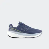 Championes de running New Balance 1080 v15, color azul con suela alta blanca y gris, y detalles en verde lima.