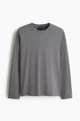 Remera de manga larga H&M, confeccionada en punto de algodón liviano, con cuello redondo y corte estándar.