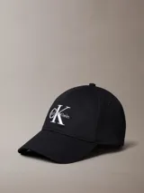 Gorra de béisbol negra con visera curva y logo de Calvin Klein bordado en blanco en el frente.