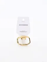 Pinza para el pelo tipo garra de metal color dorado, con forma ovalada irregular y detalles de picos en el borde inferior.